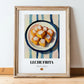 Leche Frita – on Striped Tablecloth, Spanish Dessert Wall Decor, in wooden frame leaning on the floor