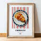 Croissant – on Striped Tablecloth, French French Pastry Wall Art, in wooden frame leaning on the floor
