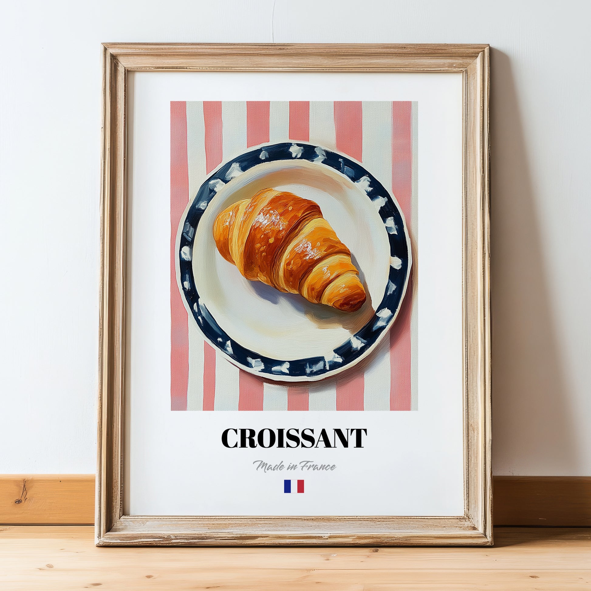 Croissant – on Striped Tablecloth, French French Pastry Wall Art, in wooden frame leaning on the floor