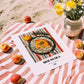 Moussaka – on Striped Tablecloth, Greek Food Print, unframed on coastal sand