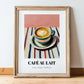 Café Au Lait – on Striped Tablecloth, French Coffee Print, in wooden frame leaning on the floor