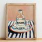 Boukha – on Striped Tablecloth, Tunisian Wine Still Life, no-text version framed in wood