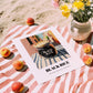 Black Rice – Italian Street Café Scene, Dry Goods Wall Art, unframed on coastal sand