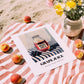 Grape Juice – on Striped Tablecloth, Lemonade Print, unframed on coastal sand