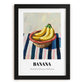 Banana – on Striped Tablecloth, Fruit Wall Decor, in sleek black frame