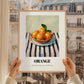 Orange – on Striped Tablecloth, Fruit Still Life, styled in a charming Paris street view