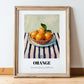 Orange – on Striped Tablecloth, Fruit Still Life, in wooden frame leaning on the floor