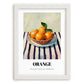 Orange – on Striped Tablecloth, Fruit Still Life, placed in minimal white frame