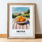 Orange – Valley Café Scene, Fruit Painting, in wooden frame leaning on the floor