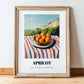 Apricot – Valley Café Scene, Fruit Poster, in wooden frame leaning on the floor