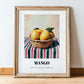 Mango – on Striped Tablecloth, Fruit Painting, in wooden frame leaning on the floor