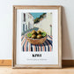 Kiwi – White village Outdoor Café Scene, Fruit Wall Art, in wooden frame leaning on the floor