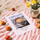 Caffè latte – Italian Coffee, Konditorei Print, unframed on coastal sand