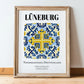 Lüneburg, Germany – Travel Poster, in wooden frame leaning on the floor