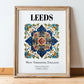 Leeds, England – Vintage Travel Poster, in wooden frame leaning on the floor