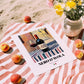 Nero d'Avola – Italian Red Wine, Enoteca Poster, unframed on coastal sand